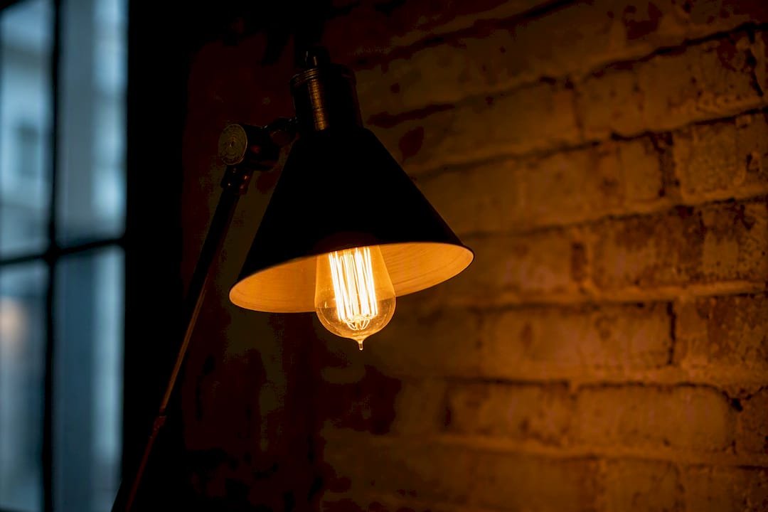 Dim glowing vintage incandescent bulb close-up