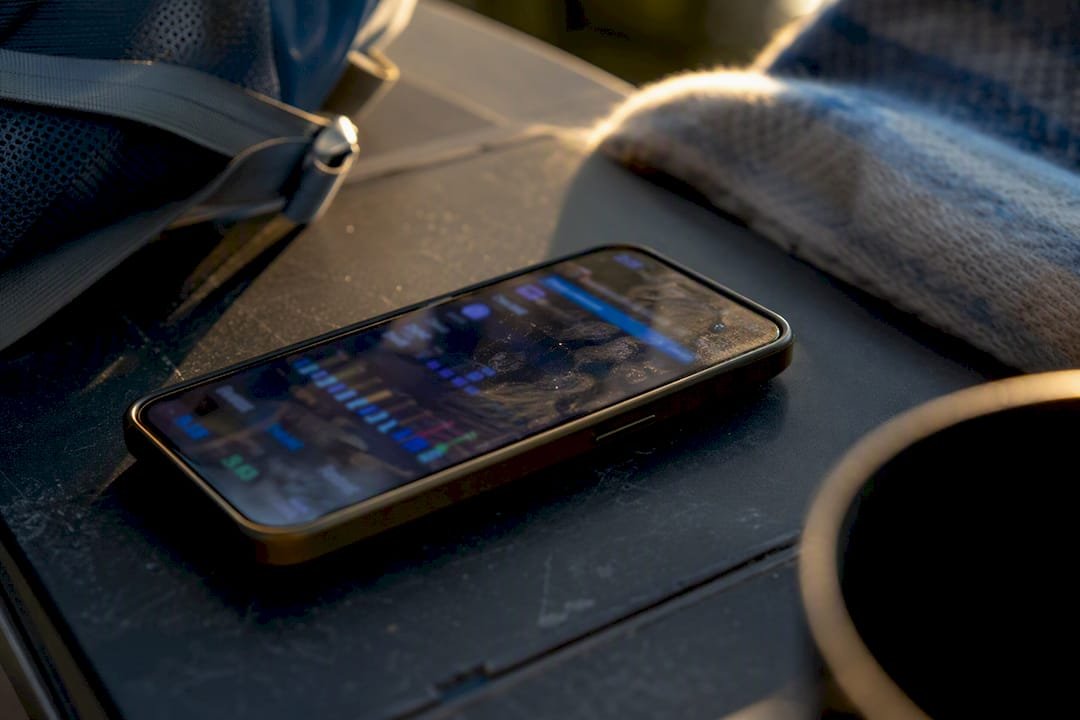 Smartphone battery indicators and smudged screen close-up