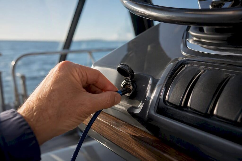 USB-C cable connected at a boat helm