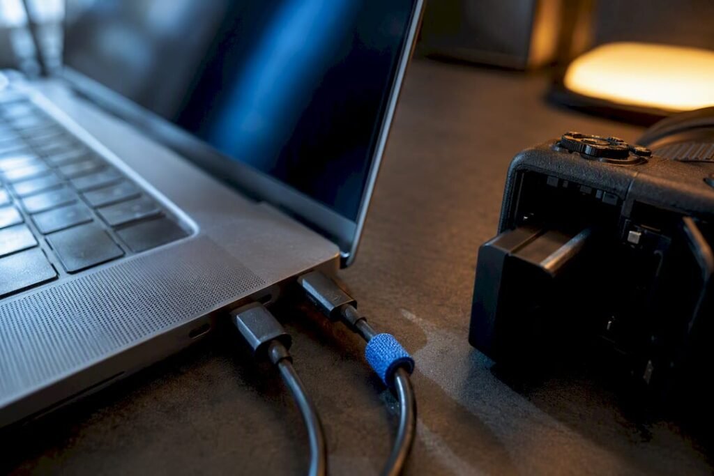 Laptop and camera charging setup in field