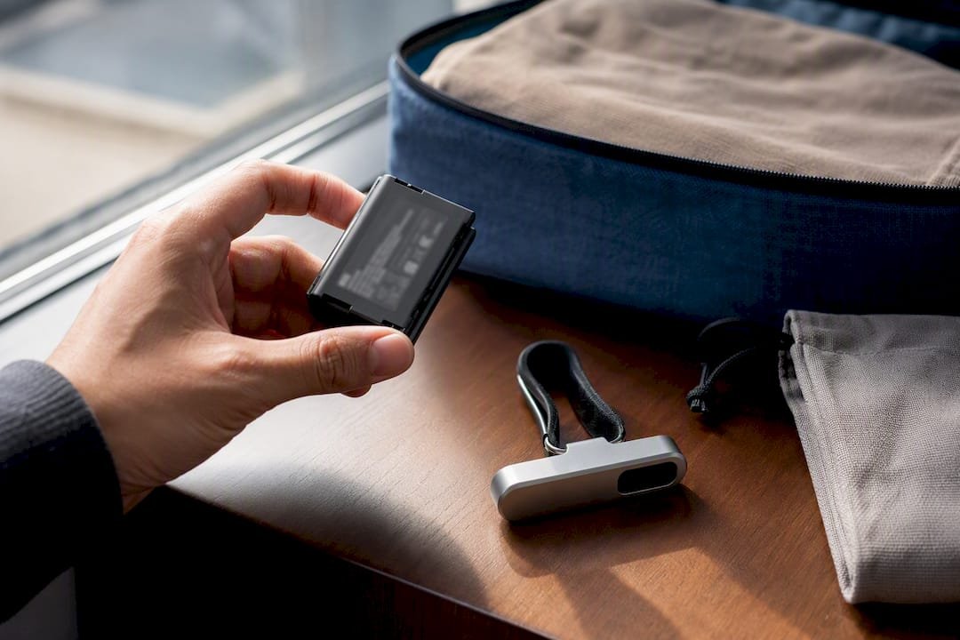 Traveler checking battery before air travel